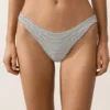 Braguitas de bikini de corte en U y cobertura media con estampado de lunares en jacquard Braguitas de bikini de corte en U y cobertura media con estampado de lunares en jacquard