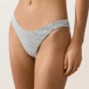 Braguitas de bikini de corte en U y cobertura media con estampado de lunares en jacquard Braguitas de bikini de corte en U y cobertura media con estampado de lunares en jacquard