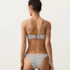 Braguitas de bikini de corte en U y cobertura media con estampado de lunares en jacquard Braguitas de bikini de corte en U y cobertura media con estampado de lunares en jacquard