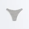 Braguitas de bikini de corte en U y cobertura media con estampado de lunares en jacquard Braguitas de bikini de corte en U y cobertura media con estampado de lunares en jacquard