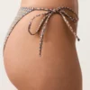 Braguitas de bikinis de cobertura media con estampado mini de hilo metálico y lazos Braguitas de bikinis de cobertura media con estampado mini de hilo metálico y lazos