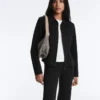 Chaqueta con volantes efecto neopreno y ribetes