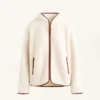 Chaqueta de imitación de piel de oveja con capucha