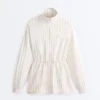 Chaqueta larga a rayas con cintura ajustable y modal Soft Touch Chaqueta larga a rayas con cintura ajustable y modal Soft Touch