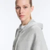 Chaqueta larga con capucha de piqué jaspeado Chaqueta larga con capucha de piqué jaspeado