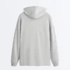 Chaqueta larga con capucha de piqué jaspeado Chaqueta larga con capucha de piqué jaspeado