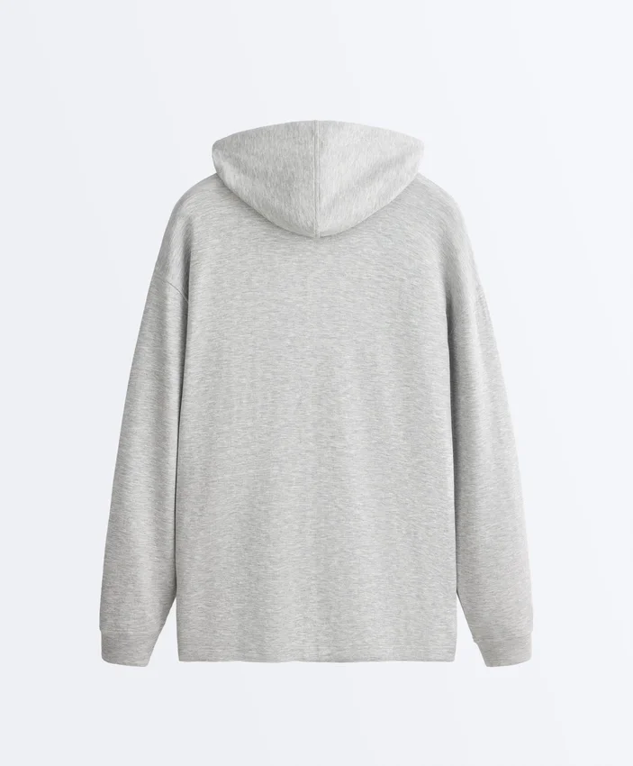 Chaqueta larga con capucha de piqué jaspeado Chaqueta larga con capucha de piqué jaspeado