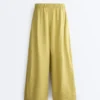 Pantalones de pierna ancha 100 % lino con pliegue lateral Pantalones de pierna ancha 100 % lino con pliegue lateral