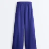 Pantalones de pierna ancha 100 % lino con pliegue lateral Pantalones de pierna ancha 100 % lino con pliegue lateral