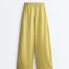 Pantalones de pierna ancha 100 % lino con pliegue lateral Pantalones de pierna ancha 100 % lino con pliegue lateral