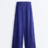Pantalones de pierna ancha 100 % lino con pliegue lateral Pantalones de pierna ancha 100 % lino con pliegue lateral
