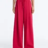 Pantalones de pierna ancha con pliegues de piqué y algodón Pantalones de pierna ancha con pliegues de piqué y algodón