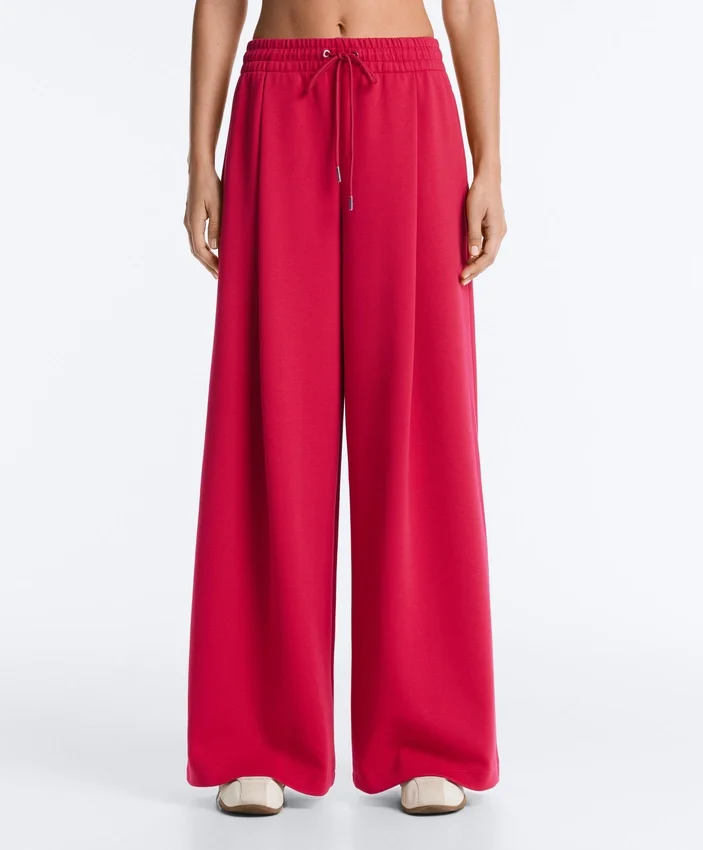 Pantalones de pierna ancha con pliegues de piqué y algodón Pantalones de pierna ancha con pliegues de piqué y algodón