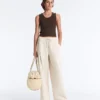 Pantalones de pierna ancha con pliegues de piqué y algodón Pantalones de pierna ancha con pliegues de piqué y algodón