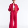 Pantalones de pierna ancha con pliegues de piqué y algodón Pantalones de pierna ancha con pliegues de piqué y algodón