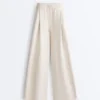 Pantalones de pierna ancha con pliegues de piqué y algodón Pantalones de pierna ancha con pliegues de piqué y algodón