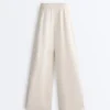 Pantalones de pierna ancha con pliegues de piqué y algodón Pantalones de pierna ancha con pliegues de piqué y algodón
