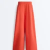 Pantalones de pierna ancha de algodón piqué con pliegues
