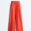 Pantalones de pierna ancha de algodón piqué con pliegues