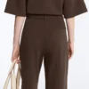 Pantalones de piqué ajustados de talle bajo con algodón Pantalones de piqué ajustados de talle bajo con algodón