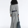 Pantalones de punto de pierna ancha con rayas diagonales
