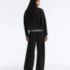 Pantalones de talle alto y pierna ancha con efecto neopreno Pantalones de talle alto y pierna ancha con efecto neopreno