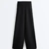 Pantalones de talle alto y pierna ancha con efecto neopreno Pantalones de talle alto y pierna ancha con efecto neopreno