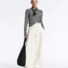 Pantalones de tiro alto de sarga y pierna ancha con pliegues Pantalones de tiro alto de sarga y pierna ancha con pliegues