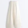 Pantalones de tiro alto de sarga y pierna ancha con pliegues Pantalones de tiro alto de sarga y pierna ancha con pliegues