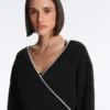 Sudadera cruzada con ribetes en contraste y modal